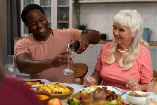 family-celebrating-thanksgiving-day-dinner-table (1)